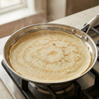 Crêpe pan with honeycomb surface and low-profile design, ideal for making crêpes, pancakes, and eggs on all cooktops including induction.