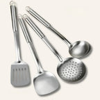 Kitchen essentials set featuring pots, utensils, and a cutting board for meal preparation, cooking, and everyday kitchen tasks.