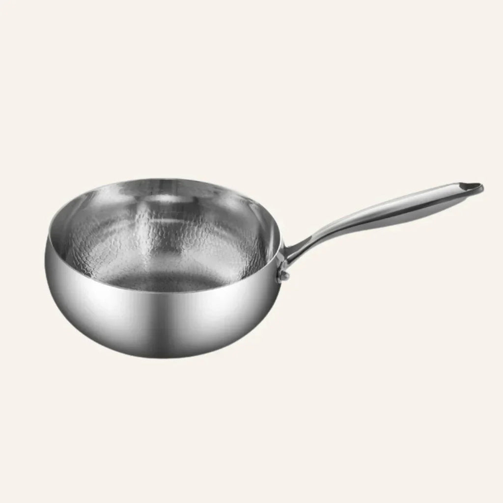 Kitchen essentials set featuring pots, utensils, and a cutting board for meal preparation, cooking, and everyday kitchen tasks.